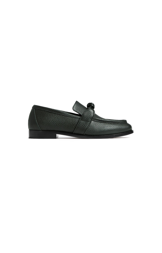 Black sneakers with white soles on a white background