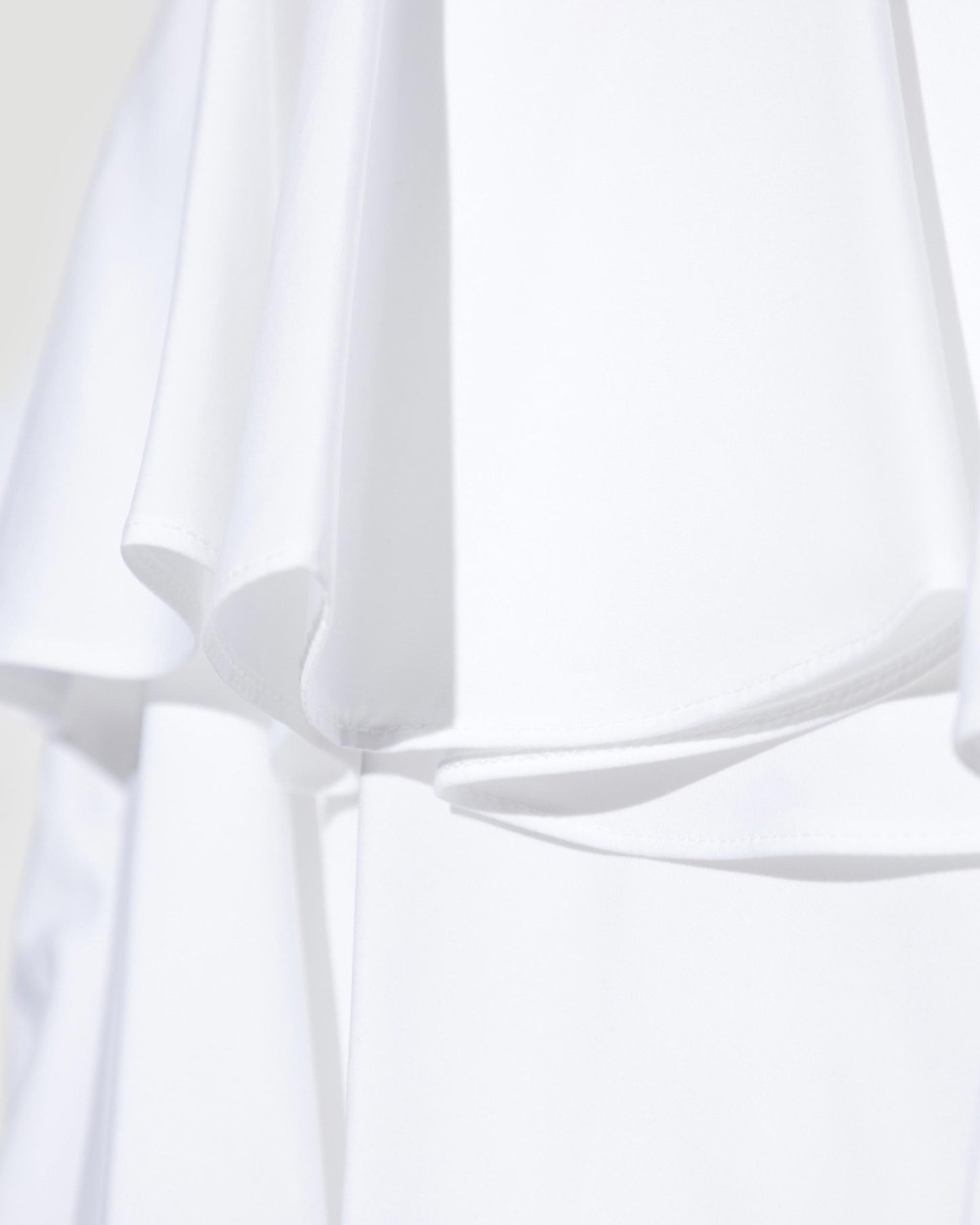 ASYMMETRICAL SKIRT IN WHITE