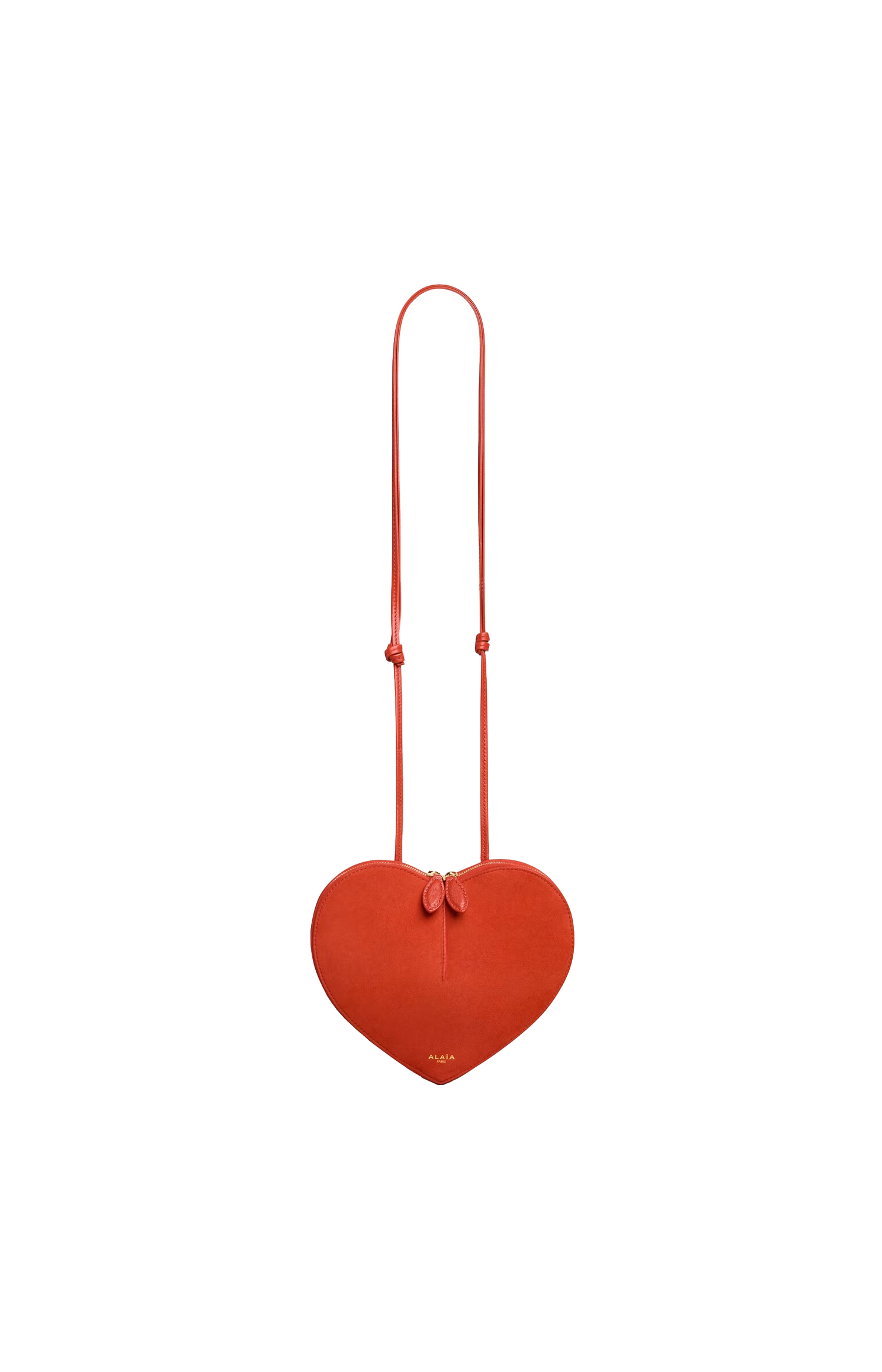 Red heart-shaped bag with a strap on a white background