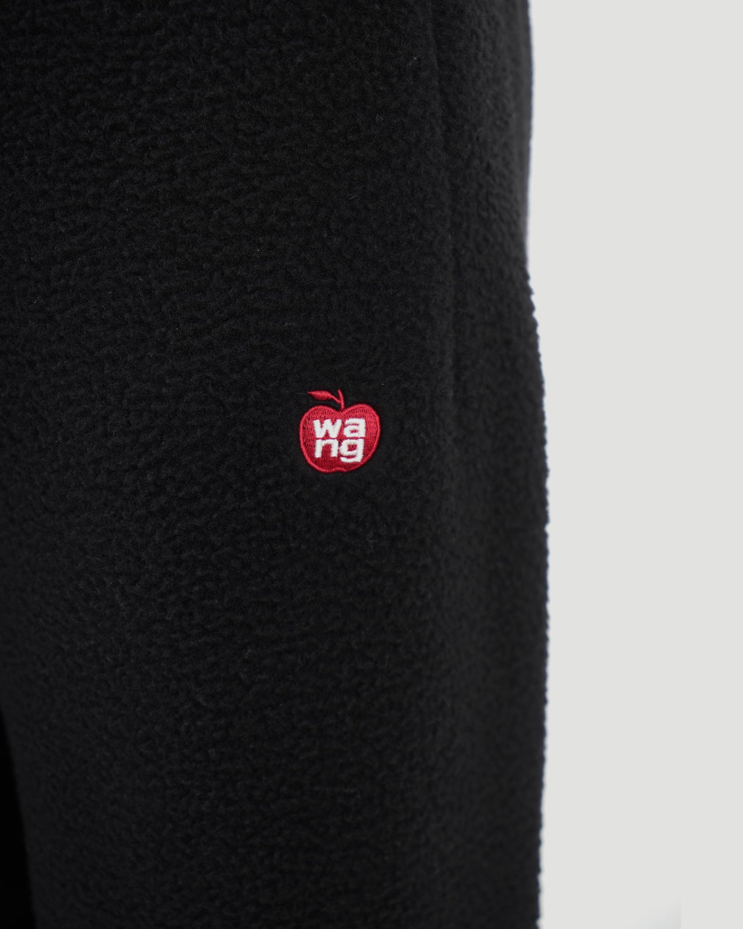Sweatpant in teddy fleece with red apple logo
