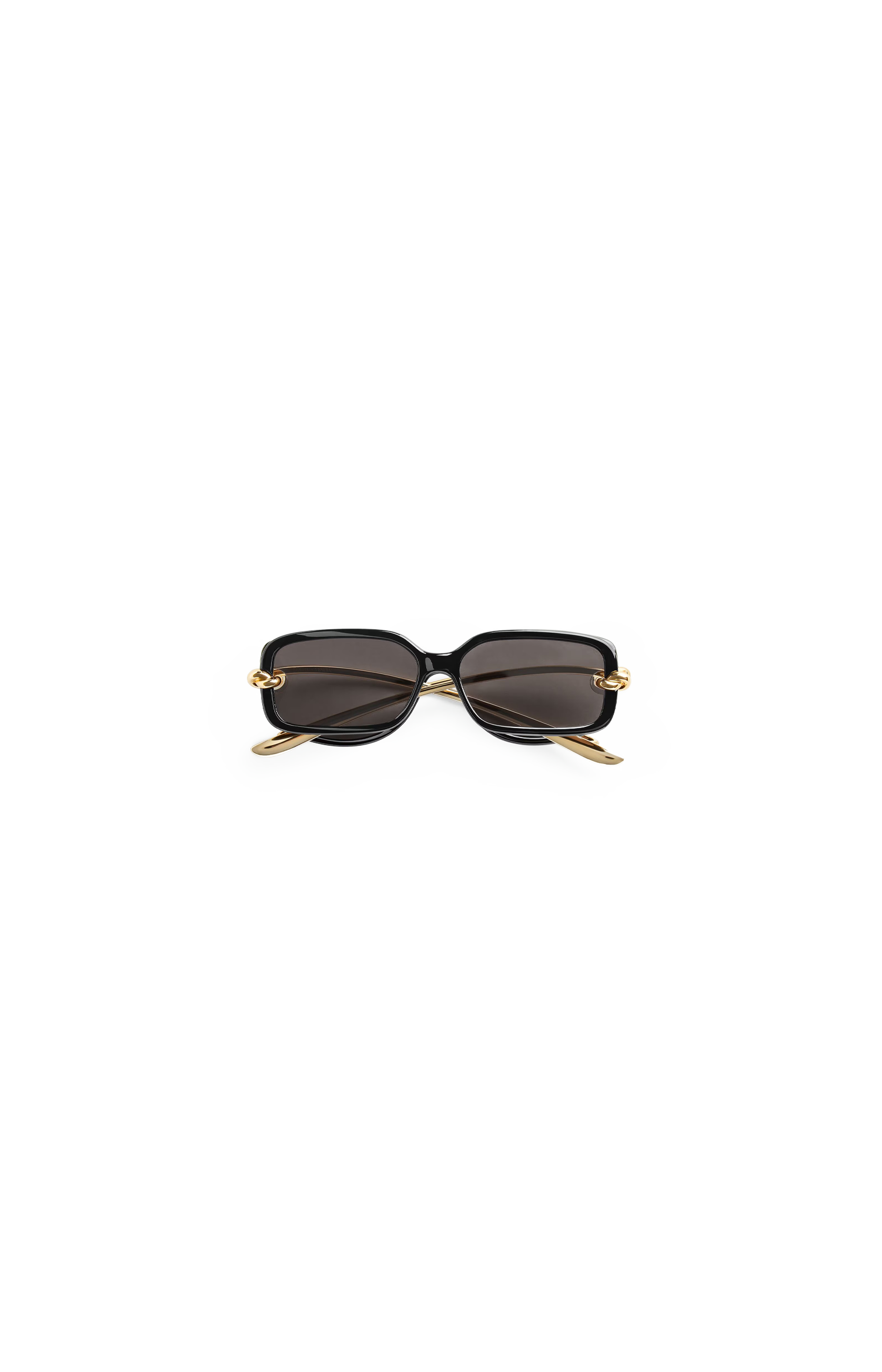 Sunglasses Bottega Veneta with gold frame and black lenses on a white background 