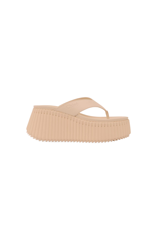 Beige platform sandal on a white background