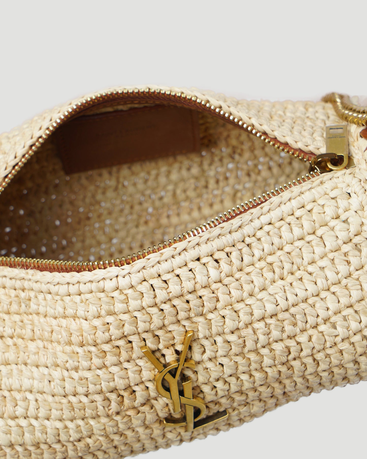 CASSANDRE SMALL CYLINDRIC BAG IN RAFFIA AND VEGETABLE-TANNED LEATHER