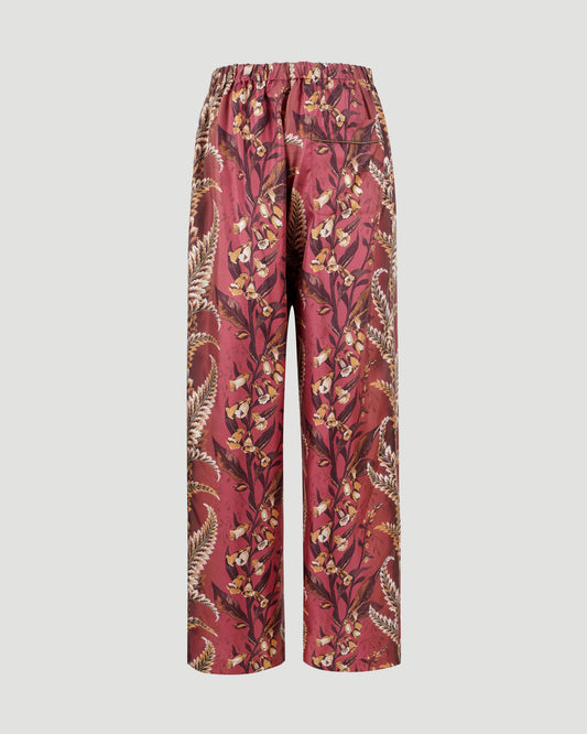 SILK PANTS WITH FLORAL MOTIF IN BRICK RED