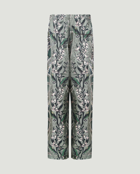 Silk pants with floral motif in green