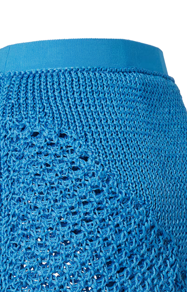 Light blue silk macramé miniskirt.