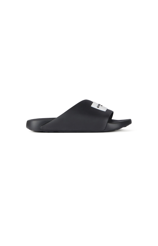 Black slide sandal on a white background