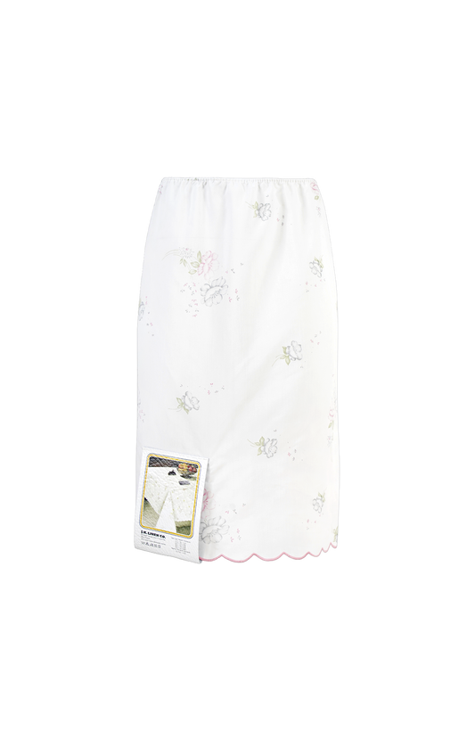 White lace skirt with floral embroidery on a white background