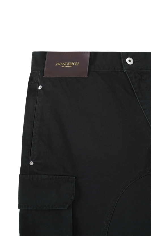 JW Anderson Twisted Patch Pocket Shorts in Black — product photo 2