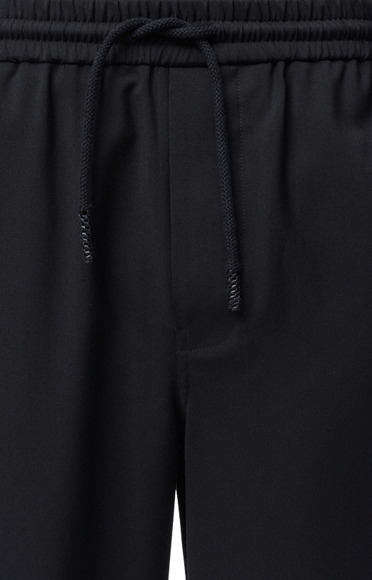 Black drawstring trousers in wool