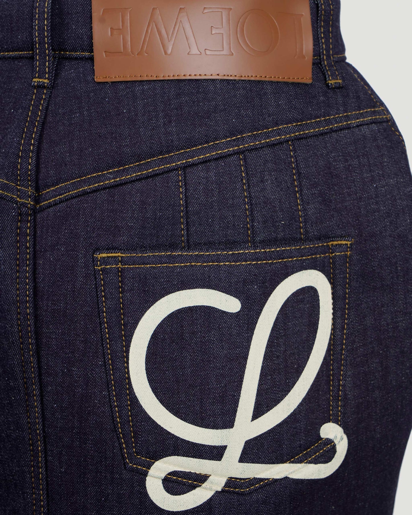 Curved mini skirt in denim