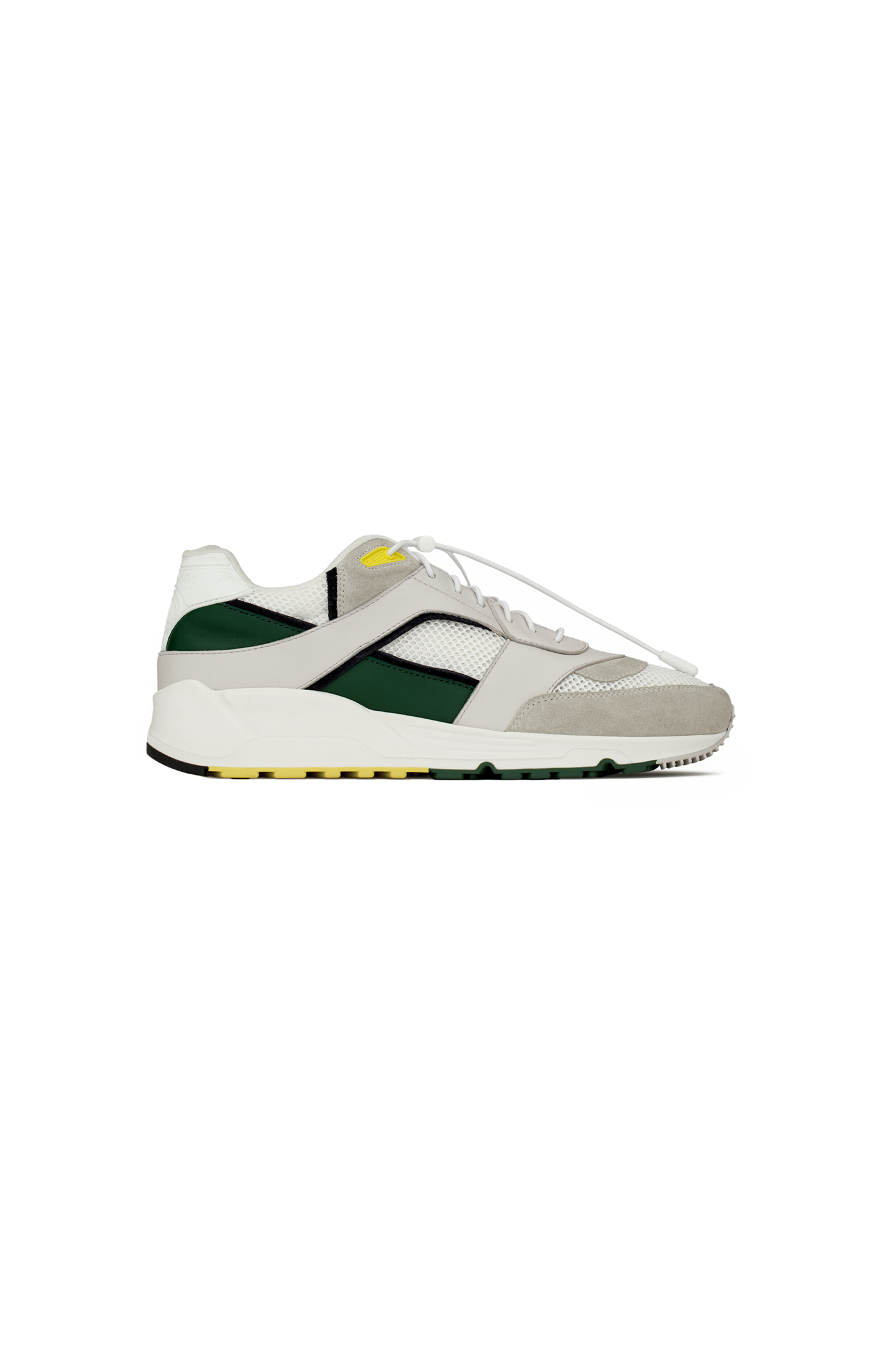 White sneaker with green accents on a white background