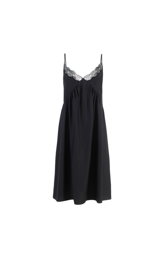 Black slip dress with lace trim on a white background